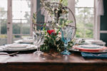 Bleak House photoshot with blush, navy, and scarlet table setting inspiration for fairytale chic events
