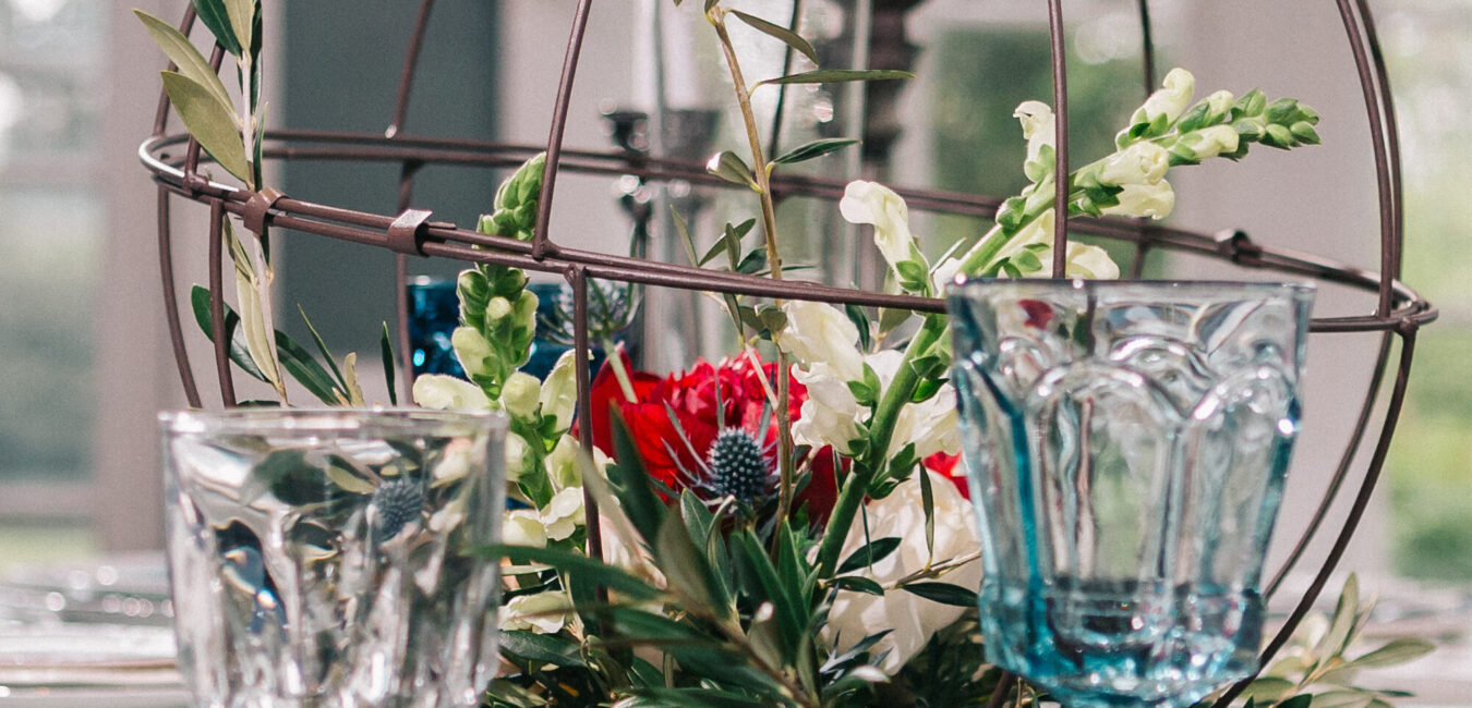Bleak House photoshot with blush, navy, and scarlet table setting inspiration for fairytale chic events