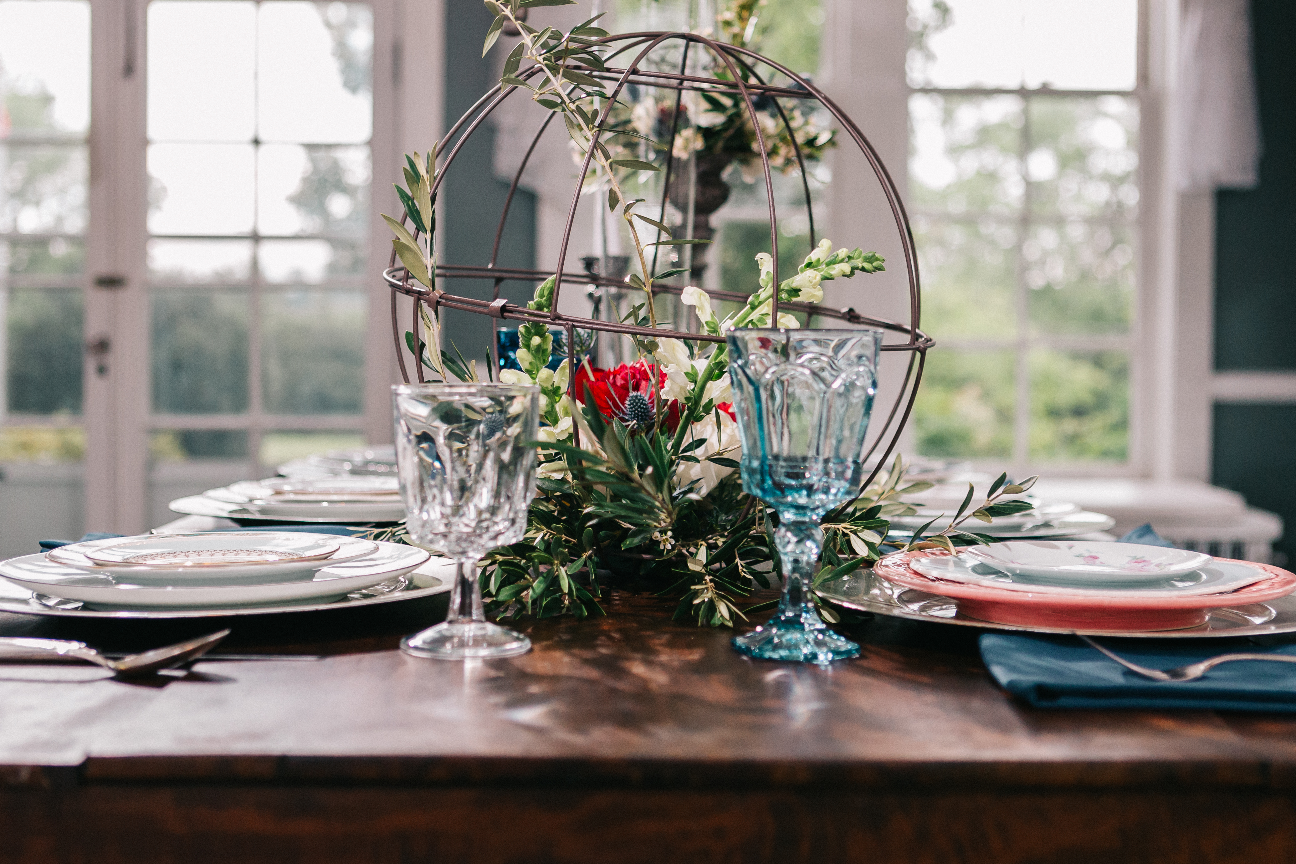 Bleak House photoshot with blush, navy, and scarlet table setting inspiration for fairytale chic events